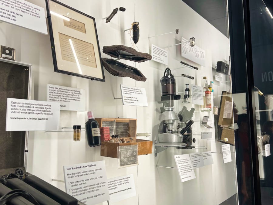 An exhibit of relics another things displayed inside a glass window