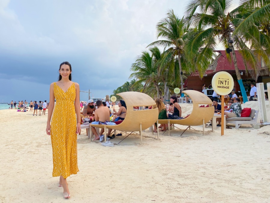 Writer Clara walks on the beach outside of Inti Beach Club in Playa del Carmen Mexico