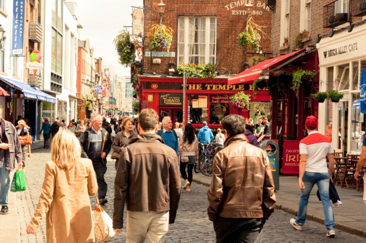 People walking past Temple Bar