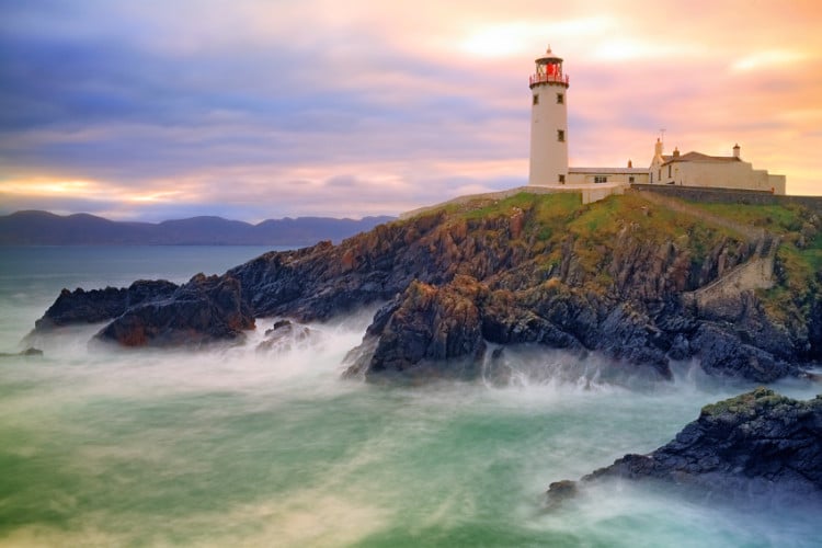 Fanad Lighthouse perched on a cliff overlooking the sea