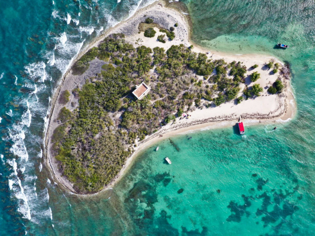 Aerial view of the heart-shaped Cardona Island surrounded by turquoise waters
