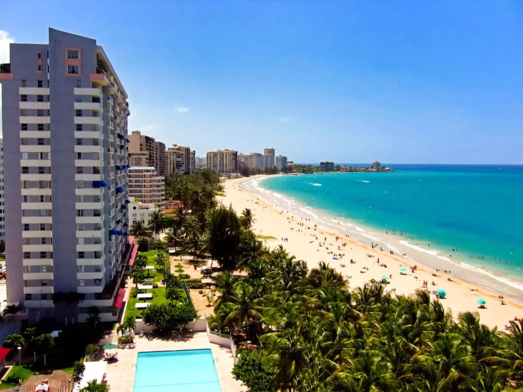 Aerial view of the cityscape with a coastline and waterfront view at Isla Verde