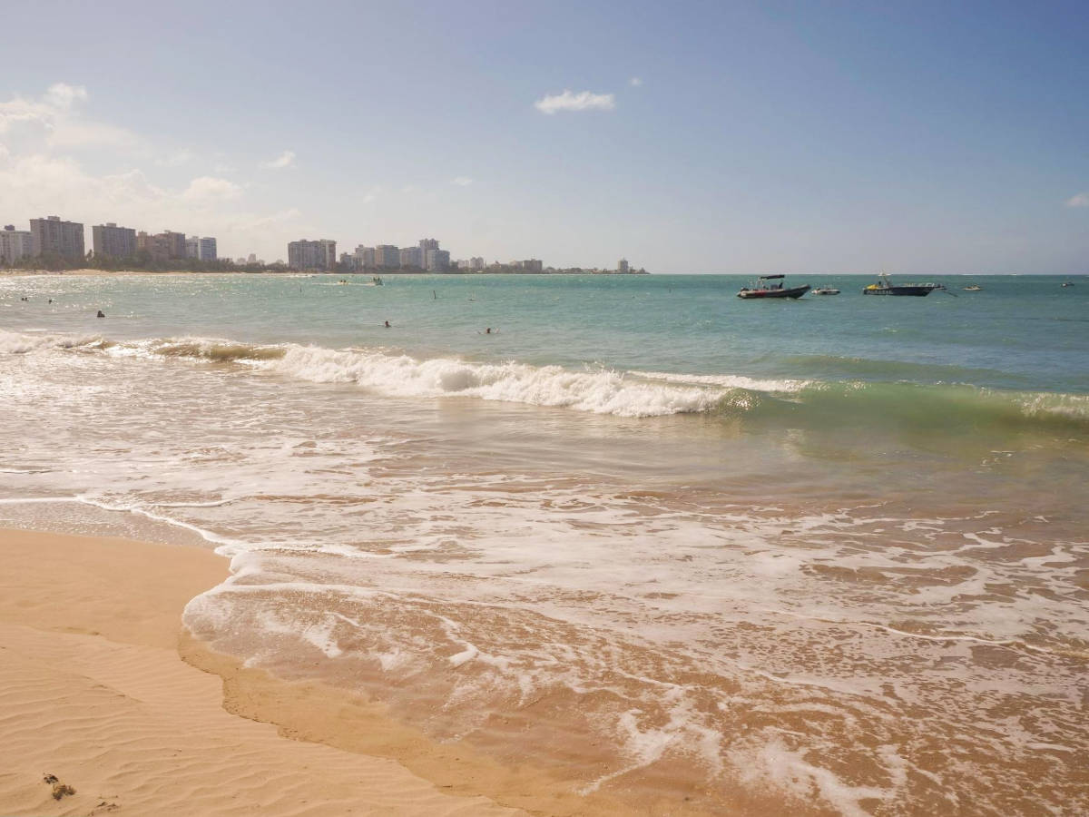 View of people enjoying their day at the Isla Verde Beach