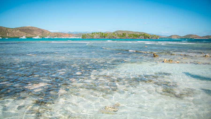 The Isla de la Mona under the clear blue sky