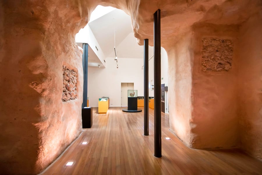 View inside the stone walled Islamic Museum of Tavira with black pillars for support