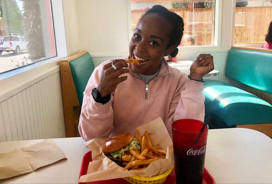 The author having a bite of her fries from Island Queen
