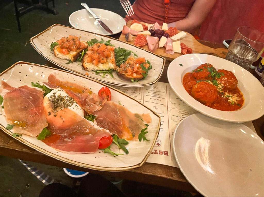 A table with variety of Italian food from Botte Bar