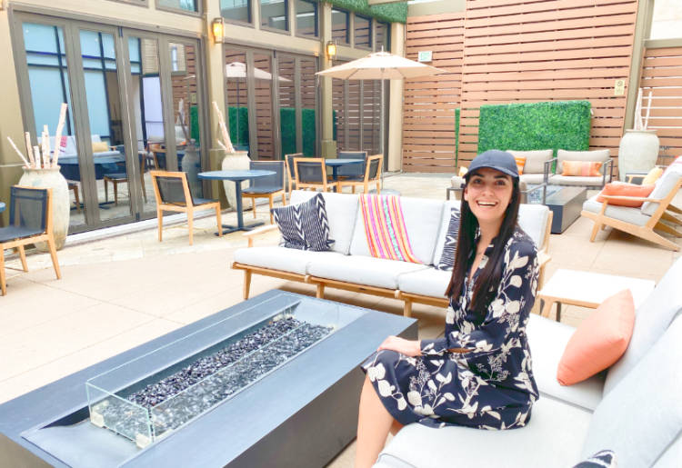 Woman in the atrium of the JW Marriott Cherry Creek in Denver