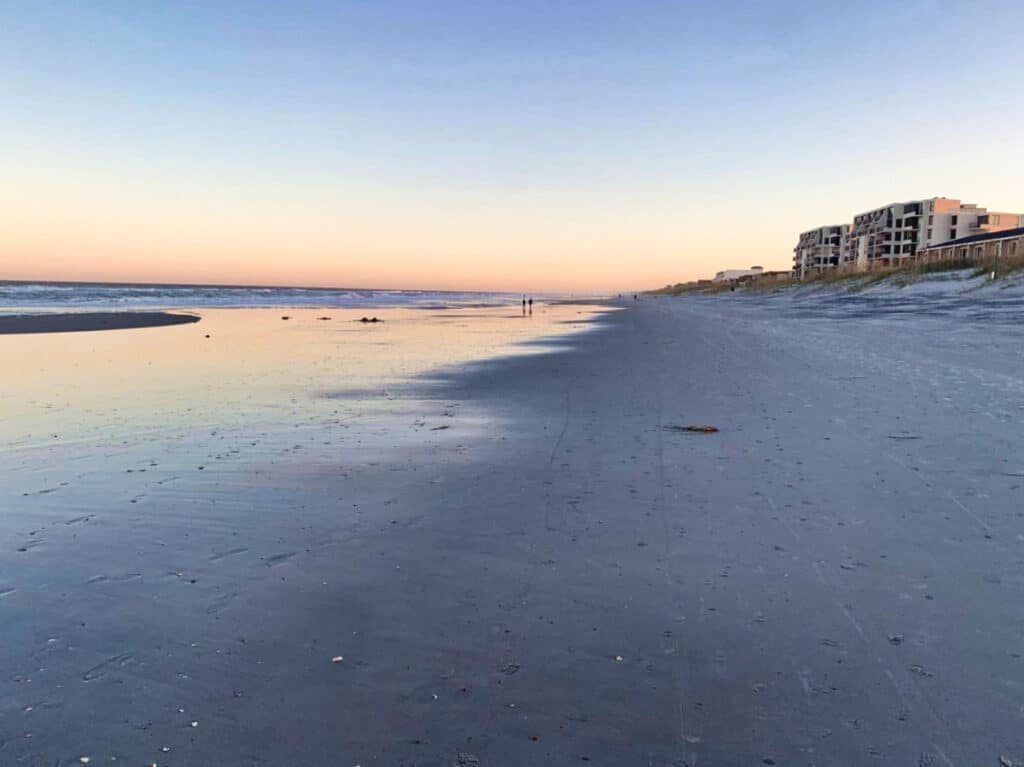 View of the calm Jacksonville Beach at sunset