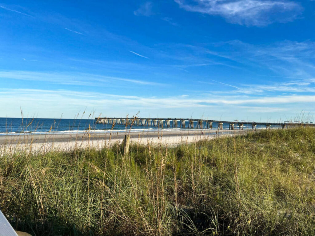 View of the long boardwalk and coastline of Jacksonville Beach