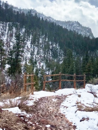 Scenic view of the light snow covered mountains and hiking trail in Jemez Mountains