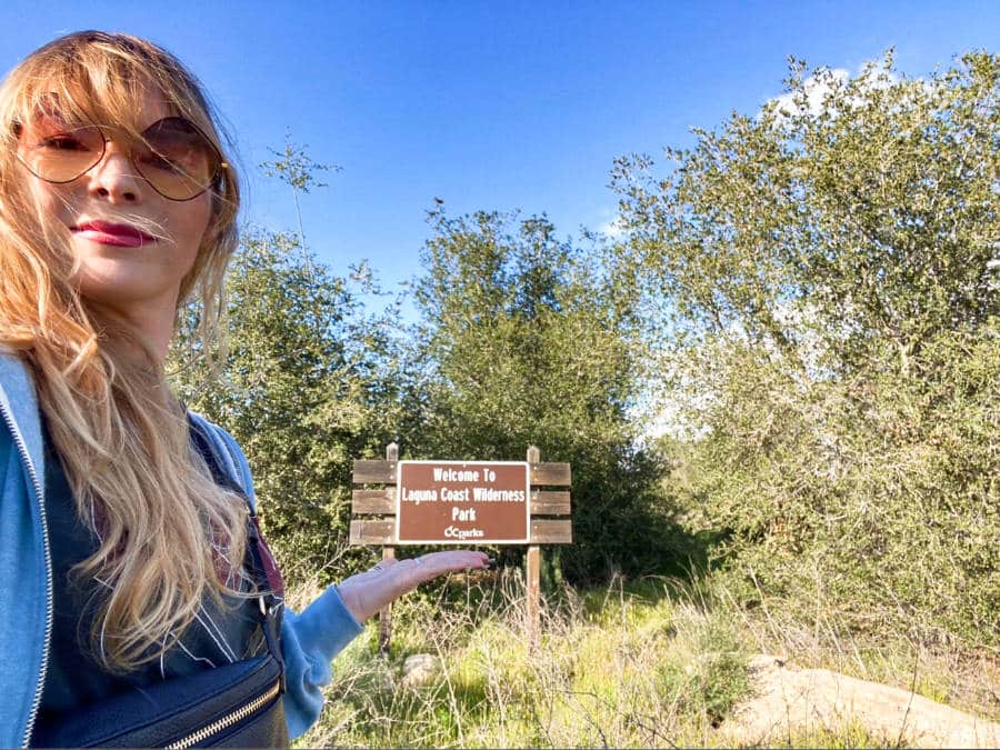The author Jericha Griffin shows the signage from the trail of Laguna Coast Wilderness Park