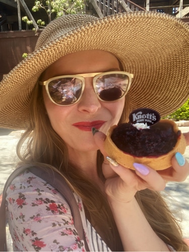 Jericha Griffin holding a pastry from Knotts Berry Farm