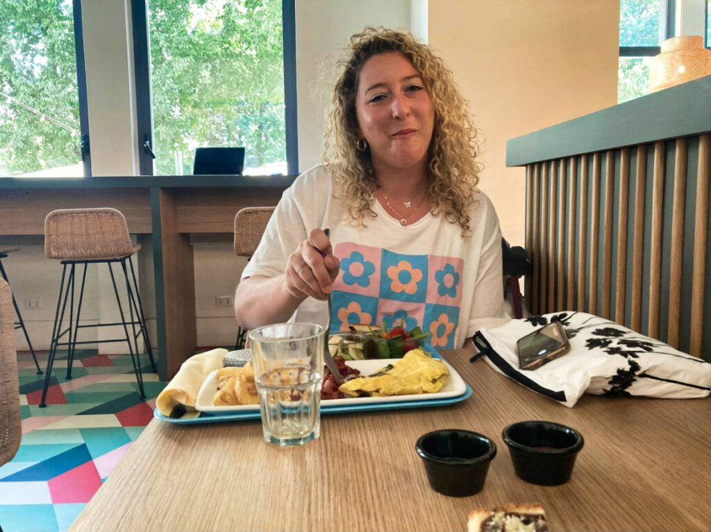 The author Jess enjoying her breakfast at the hostel