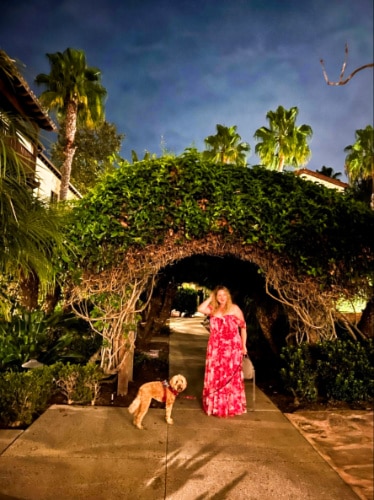 The author Jess Levy, wandering around the courtyard with her dog at Mission Estancia during nighttime