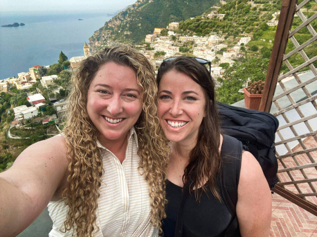 The author Jess and her friend posing for a photo with an overlooking view in the background