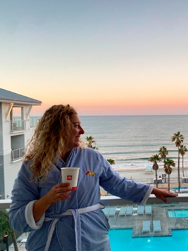 Jess Levy on the Seabird Resort balcony during sunset