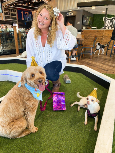 The author Jess Levy with the dogs in the mini golf turf