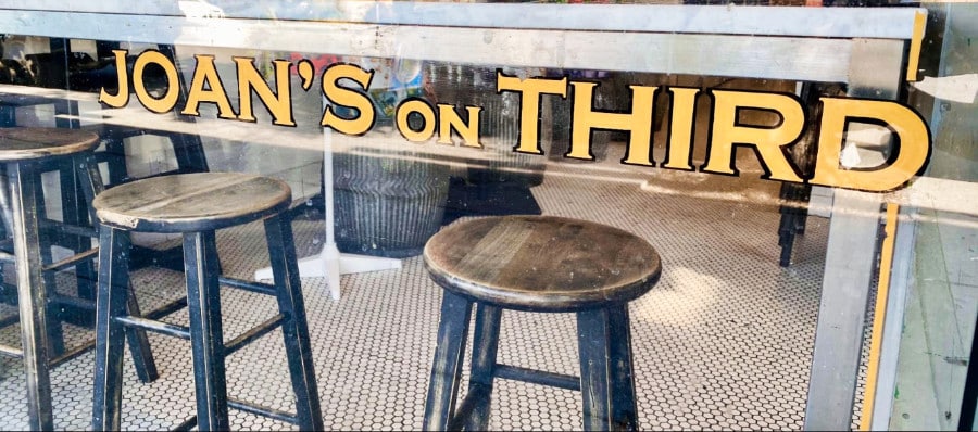 A glimpse of the interior from the glass panel outside of Joan’s on Third