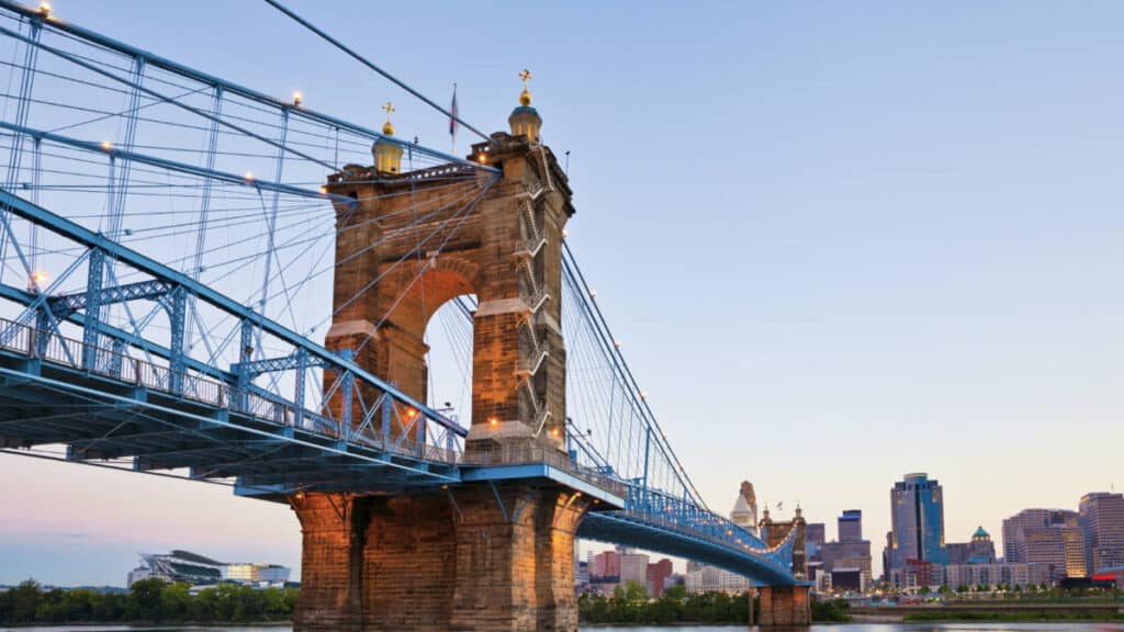 View of the John A. Roebling Suspension Bridge in Cincinnati at sunset