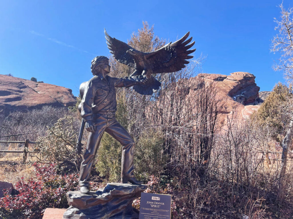 Clear blue sky over the statue of John Denver outside Colorado Music Hall of Fame
