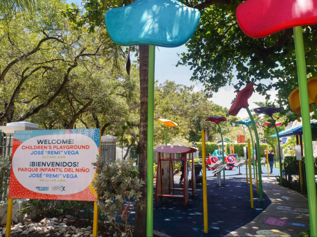 View of the signage and the colorful play area at José “Remi” Vega Children’s Playground