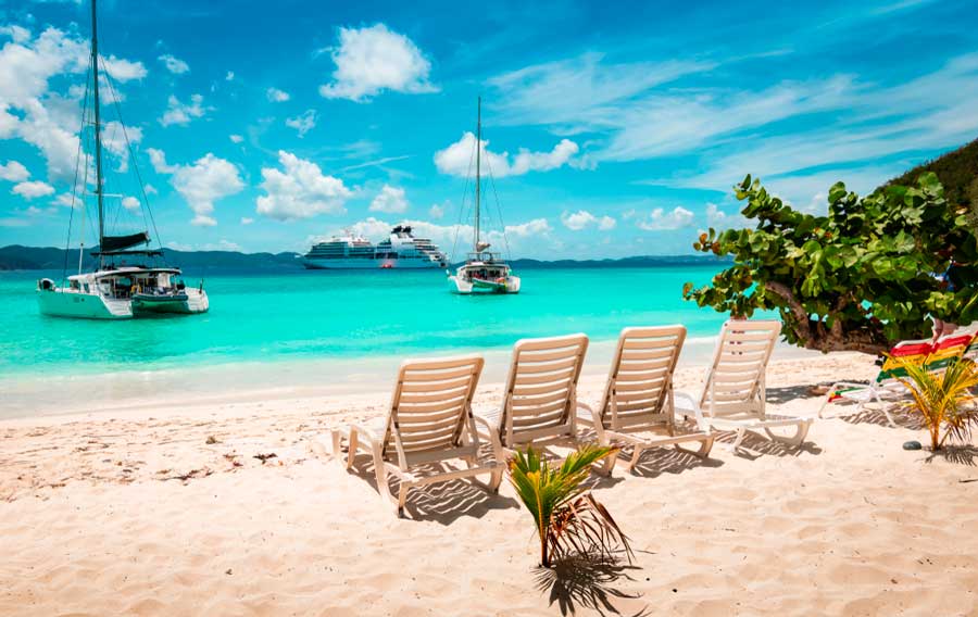 View of boats on the turquoise water of Jost Van Dyke