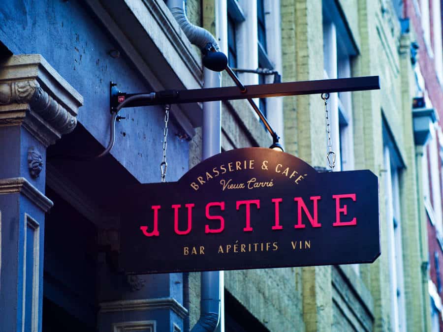 View of the hanging outdoor signage of Justine