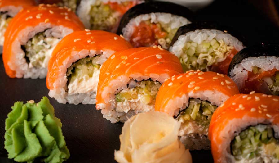 Maki rolls on a wooden board in Kabooki Sushi