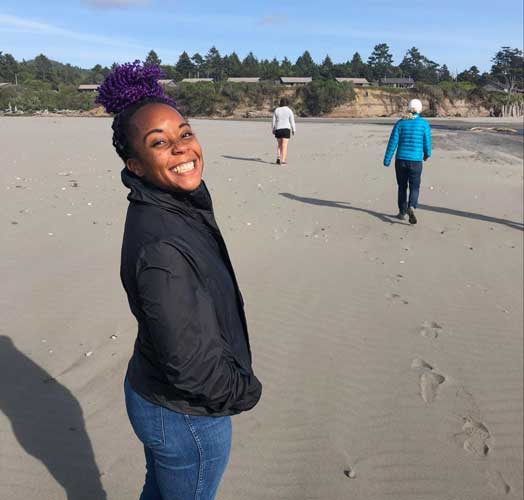 The author smiling for a photo in Kalaloch Beach