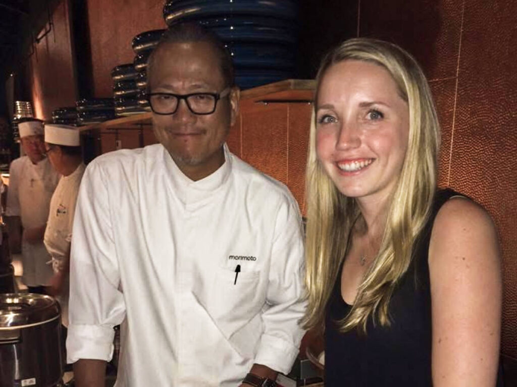 The author Katie, smiling for a photo with Chef Morimoto at the restaurant