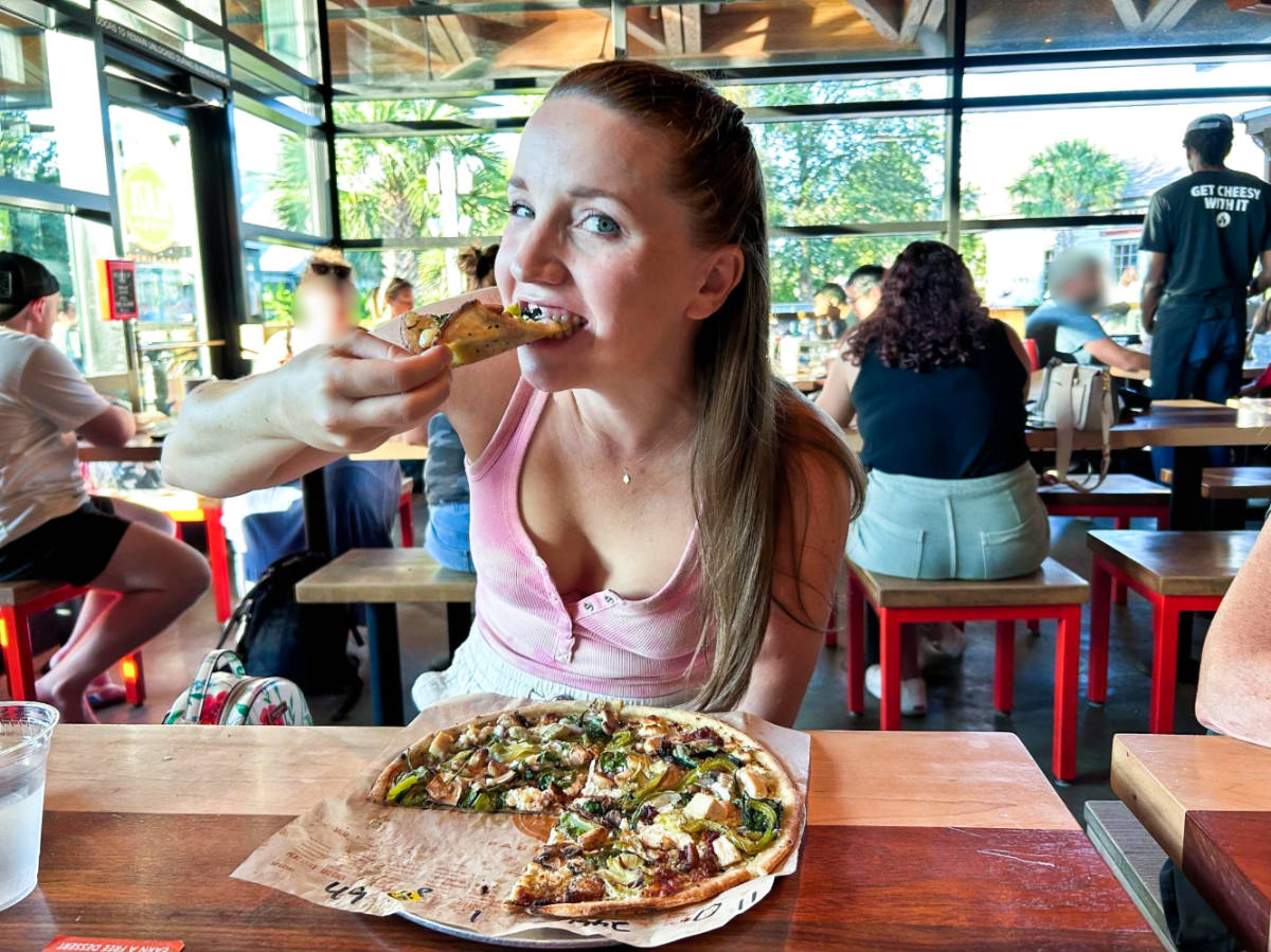 The author Katie Neufeld, eating the build-your-own pizza at Blaze