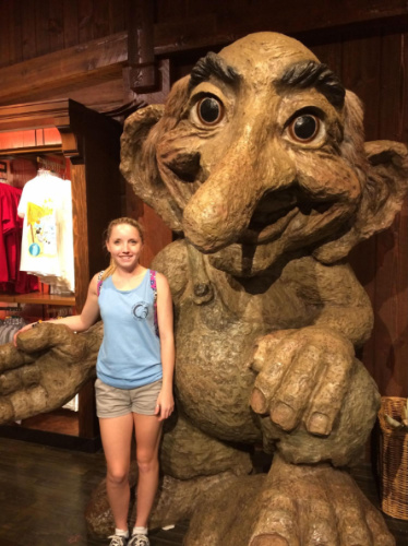 The author, Katie Neufeld with a statue in Disney World