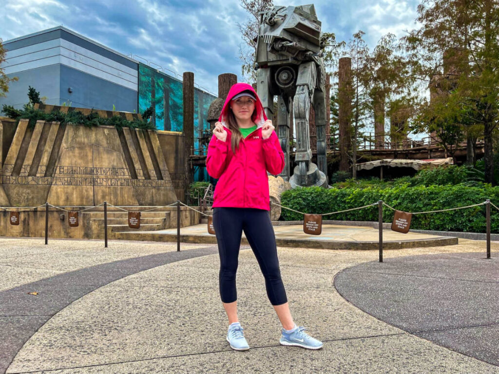 The author Katie Neufeld, posing for a photo while wearing her hooded rain jacket