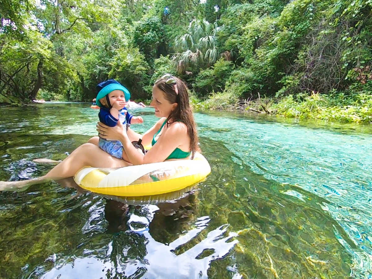 The author Katie Neufeld and her son swimming on the Kelly Park Rock Springs