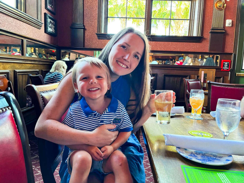 The author Katie Neufeld and her son, sitting inside the Raglan Road