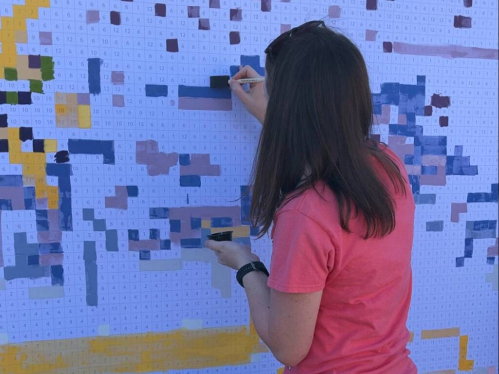 Author Katie painting at Epcot International Festival of the Arts