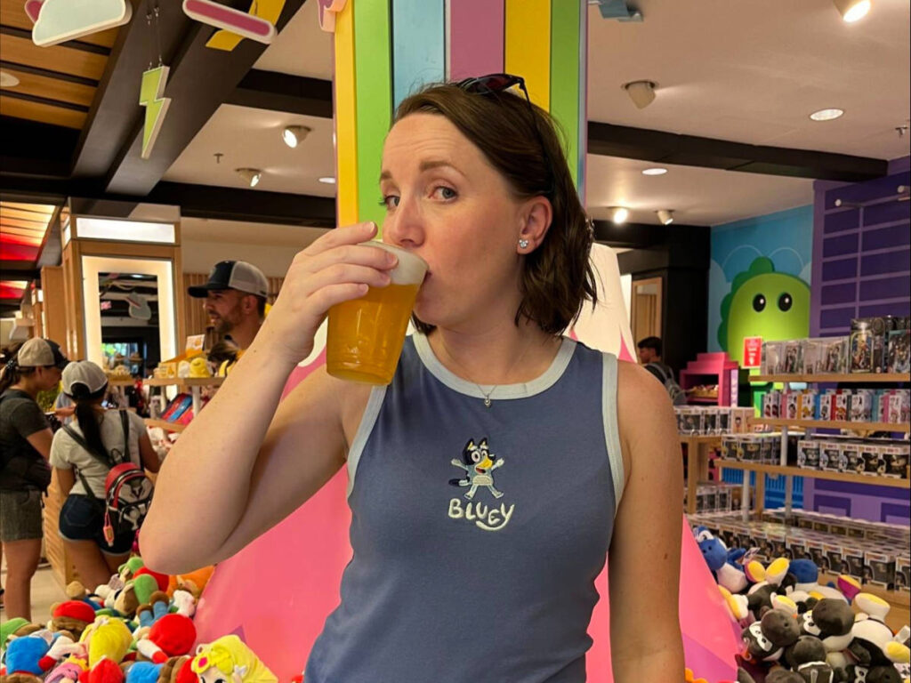 Katie trying out the drinks at Epcot International Food and Wine Festival