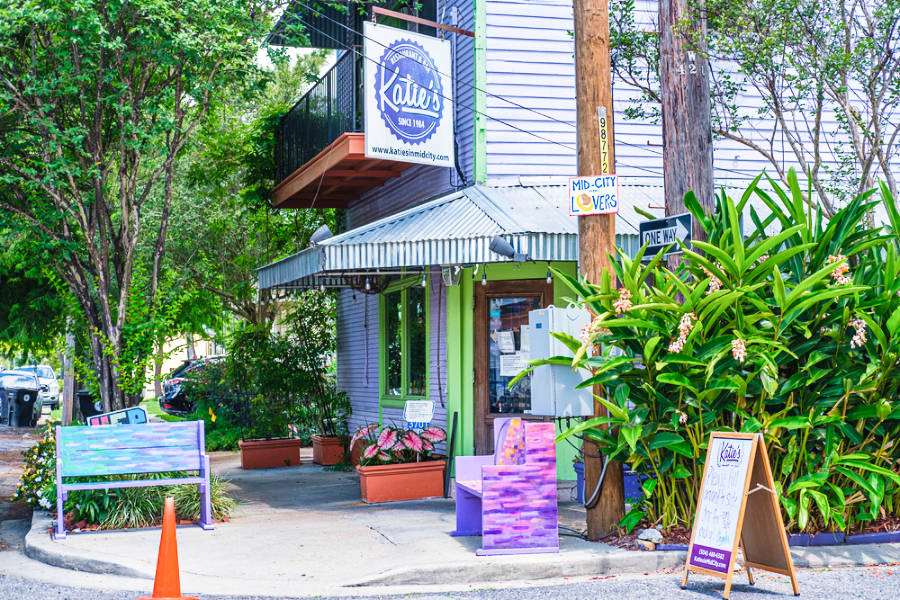View of the hanging signage of Katie’s outside the restaurant