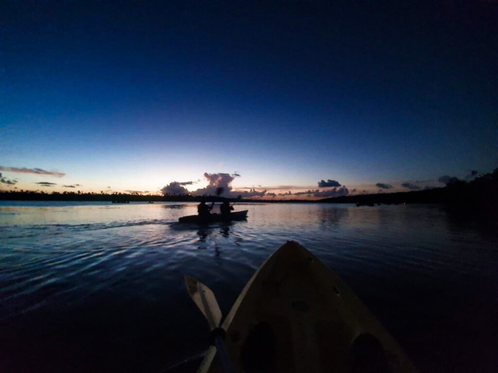 View of the people on the kayak at the Bioluminescent Bays at dusk
