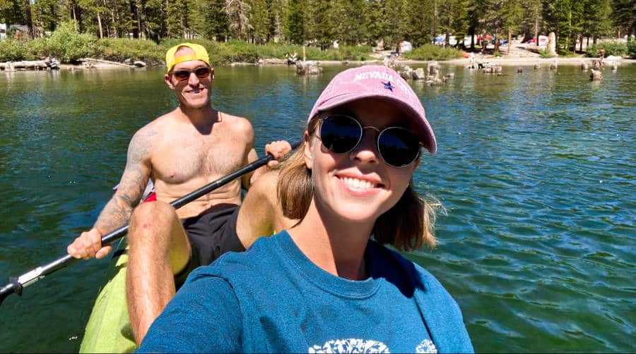 A man and woman kayaking around the beautiful Lake Mary in Mammoth Lakes