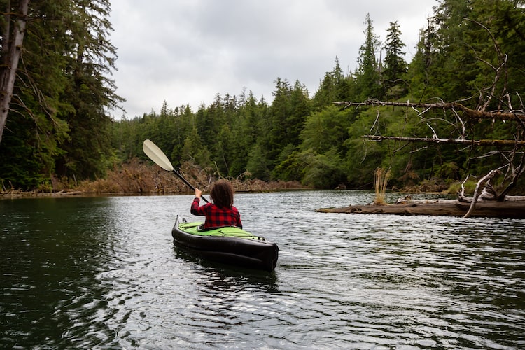 A woman kayaks on Vancouver Island