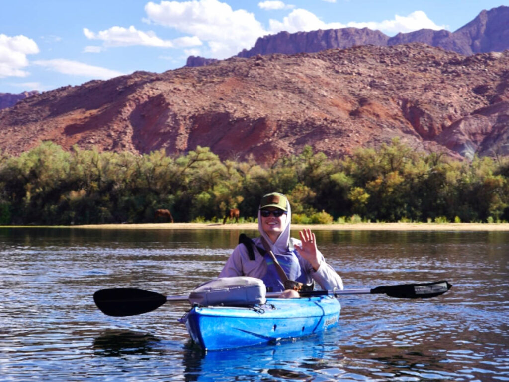 The author's brother smiling while kayaking the Colorado River