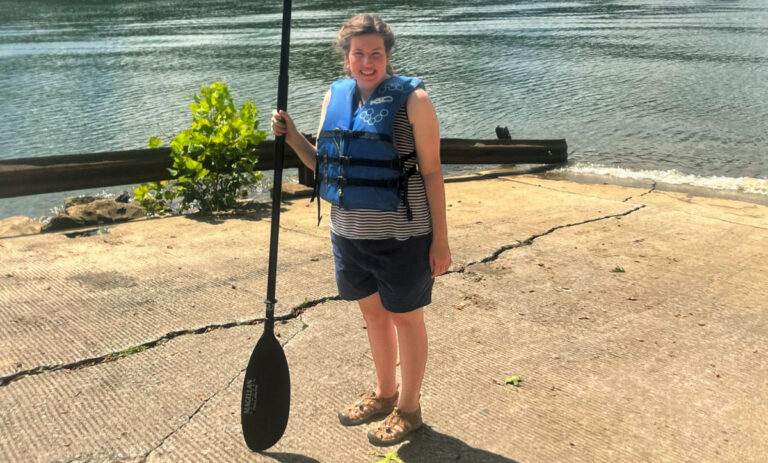 Author Elizabeth holding a paddle for kayaking in Harpeth River