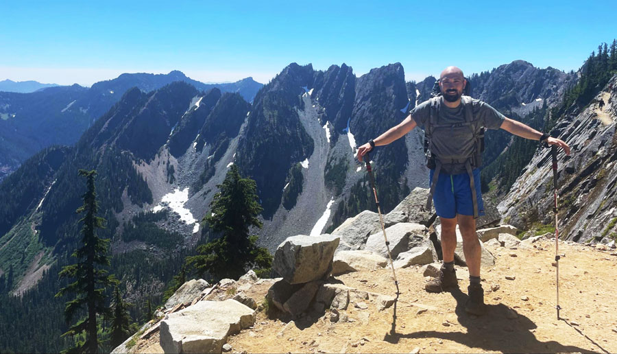 The author's husband posing for a picture on top of Kendall Katwalk