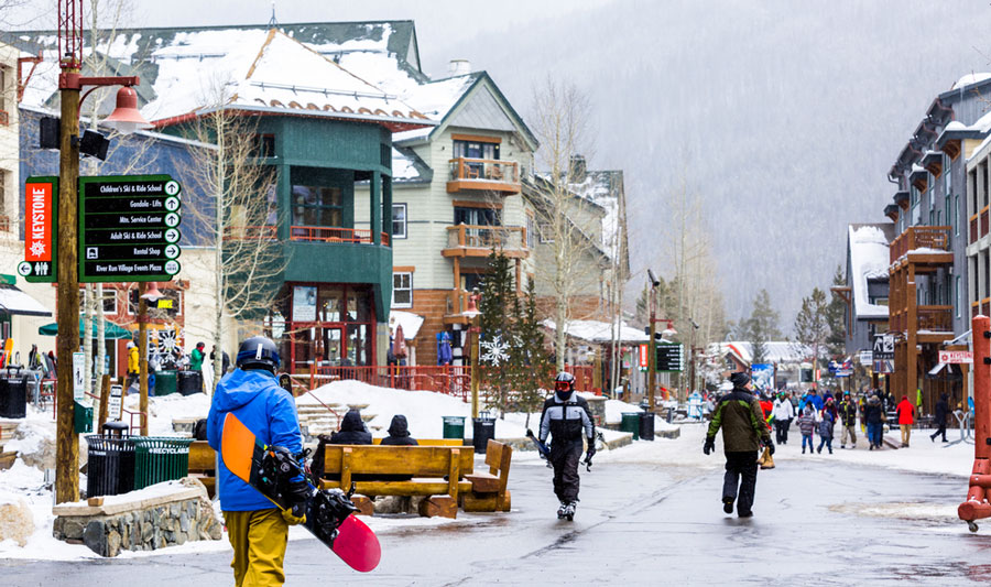 View of people ready for snowboarding in a ski resort