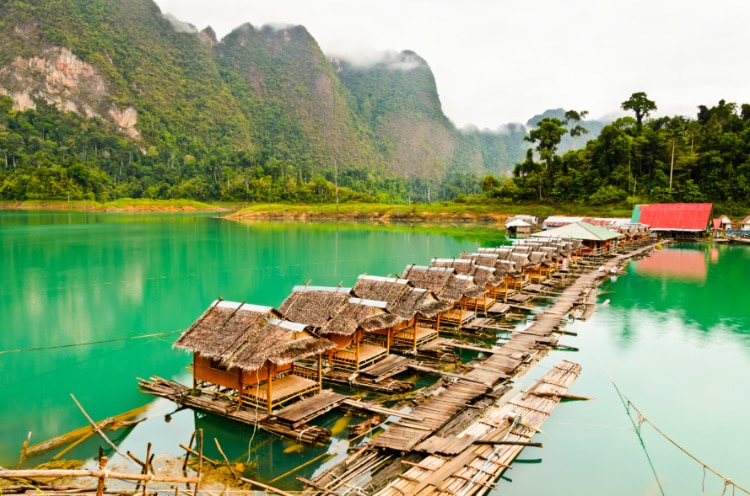 Floating huts on the Khao Sok river with mountain views