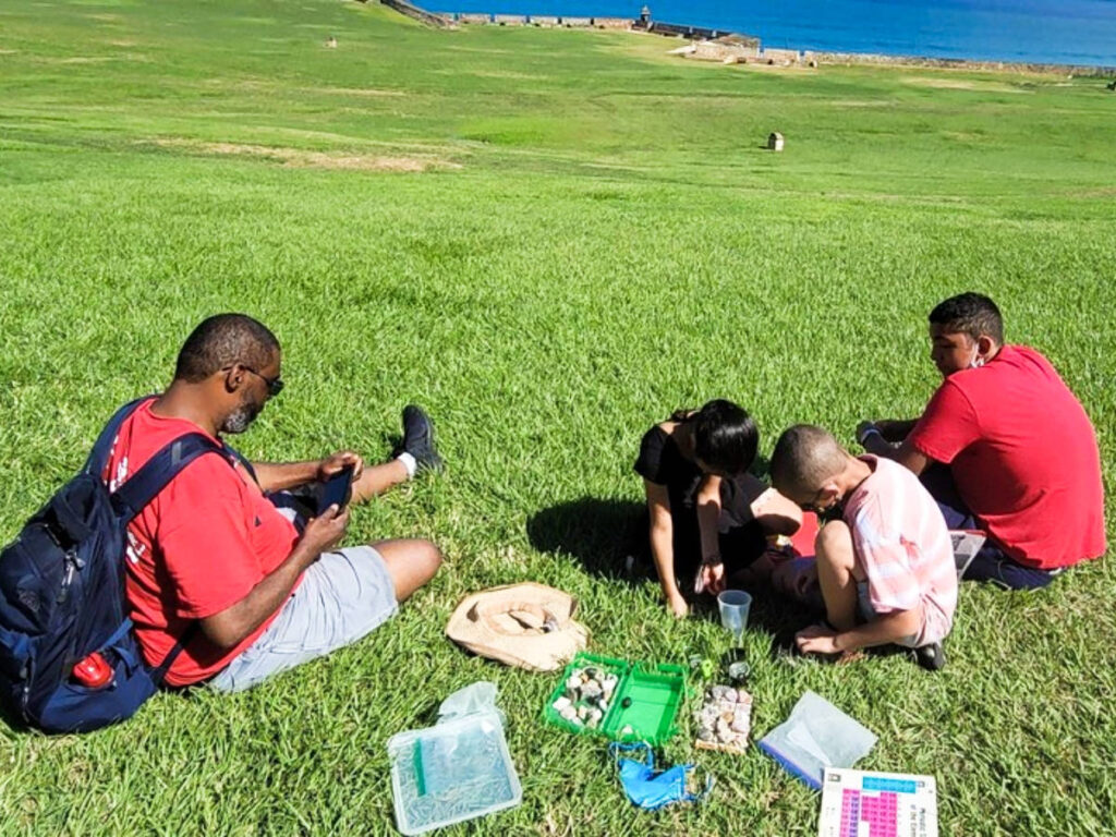 A family playing and relaxing on the vast landscape