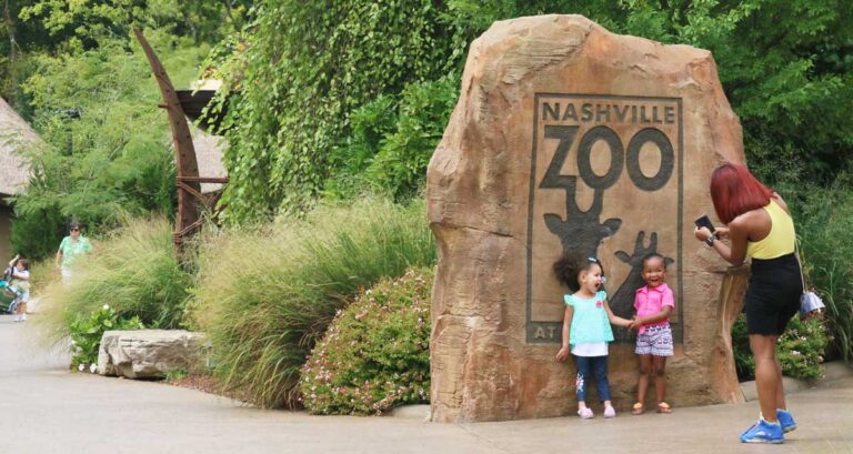 A mother taking photo of her kids in Nashville Zoo, one of the best things to do in Nashville with kids