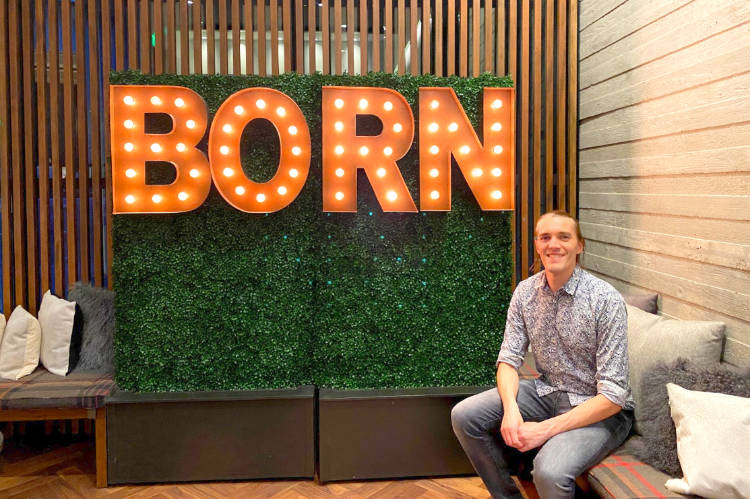 The author Nate Hake sitting in lobby of the Hotel Born, which has re-branded as the Limelight Hotel